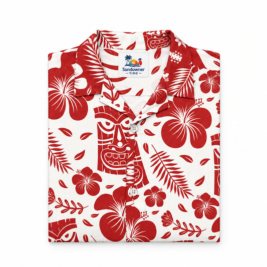 A short-sleeve button-up Hawaiian shirt with a red and white tropical pattern featuring hibiscus flowers, palm leaves, and tiki mugs, displayed flat against a white background.